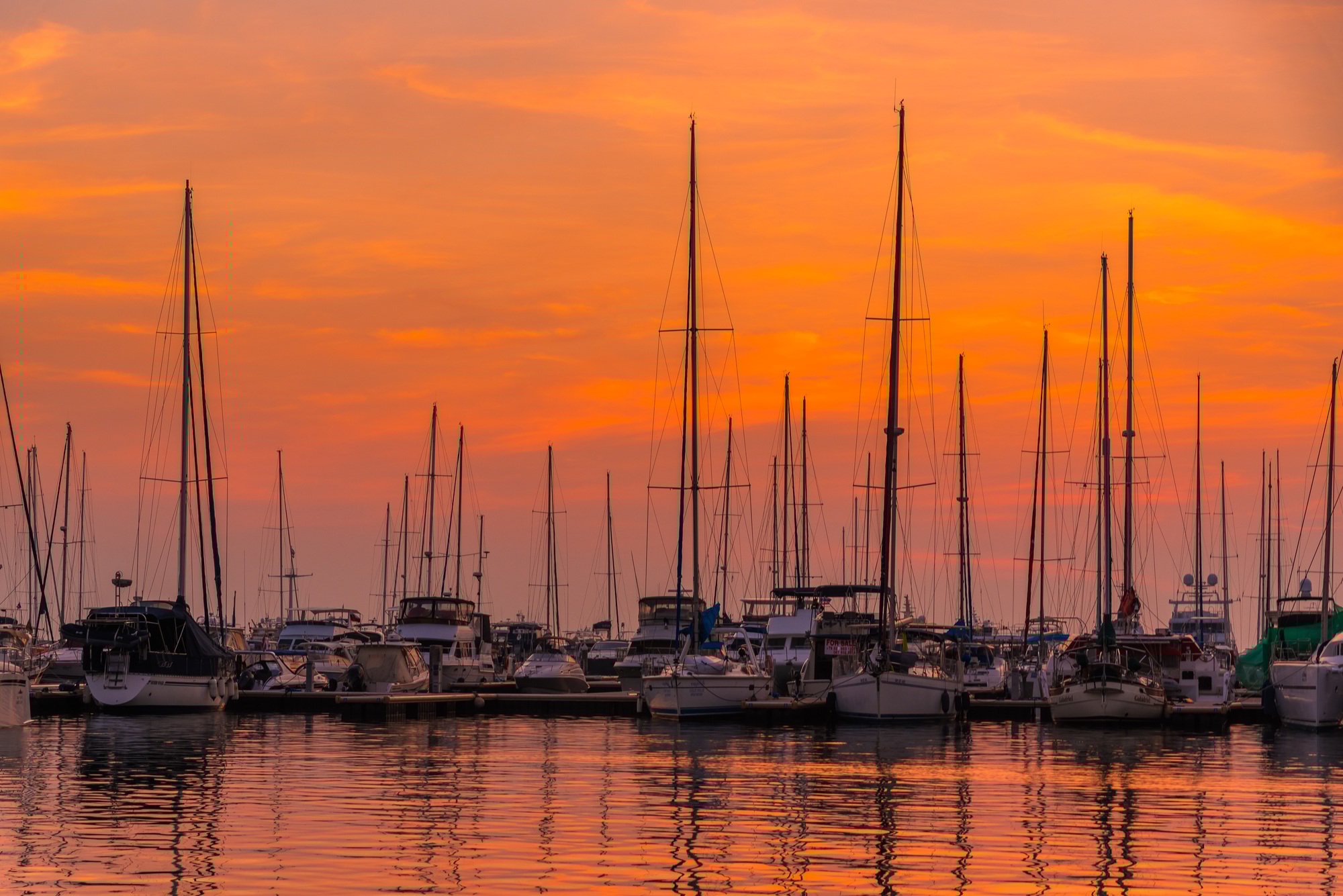 Silhouette Yacht boat with beautiful sun sky background. The vintage style yacht boat at marina harb
